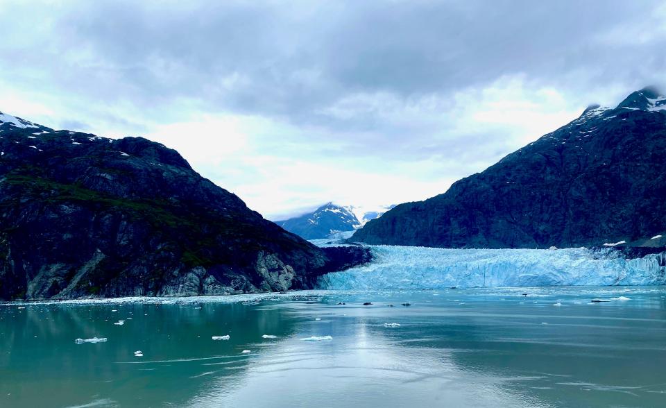 A view of a glacier among mountains.