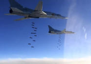 FILE - This photo, provided by the Russian Defense Ministry Press Service, shows Russian Air Force Tu-22M3 bombing Islamic State group targets in Syria, Jan. 23, 2017. Political observers say Russia’s brazen Syria intervention emboldened Putin, giving him a renewed Middle East foothold and helped pave the way for his current attack on Ukraine. (Russian Defense Ministry Press Service via AP, File)