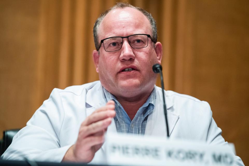 Dr Pierre Kory sits in front of a microphone, testifying before members of the US Senate.