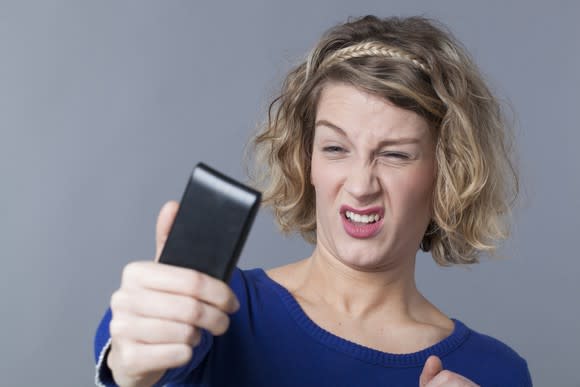 Woman frowning taking selfie