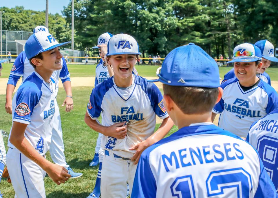 Jackson Williams celebrates with his teammmates after Saturday morning's State Championship win.