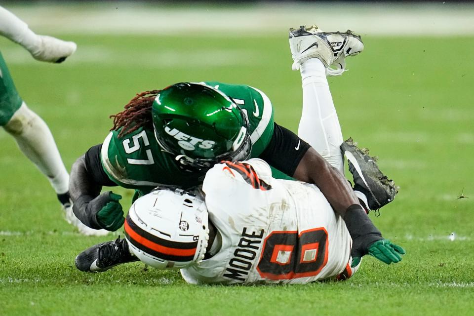 Cleveland Browns wide receiver Elijah Moore is injured on a play against New York Jets linebacker C.J. Mosley during the first half Thursday in Cleveland.