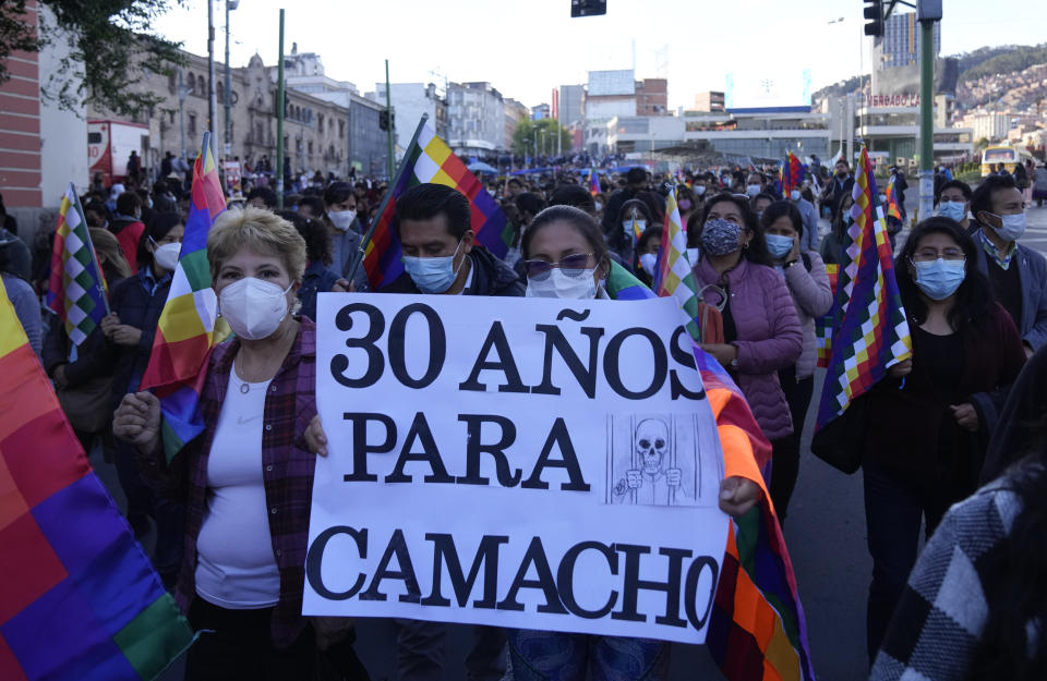 Demonstrators hold a sign demanding jail time for opposition leader and governor of Santa Cruz region Luis Fernando Camacho during a march in La Paz, Bolivia, Thursday, Jan. 12, 2023. Prosecutors on Dec. 29 remanded Camacho into custody for four months while he faces terrorism charges. (AP Photo/Juan Karita)