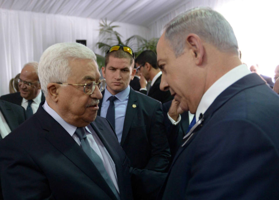 Image: Israeli PM Netanyahu shakes hands with Palestinian President Abbas during funeral of former Israeli President Shimon Peres in Jerusalem (Amos Ben Gershom/Government Press Office / Reuters file)