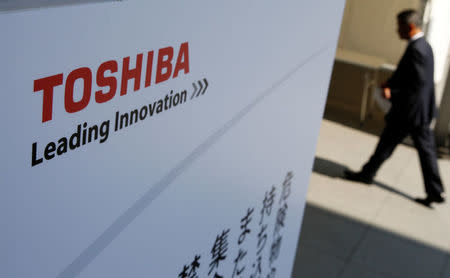 The logo of Toshiba is seen as a shareholder arrives at Toshiba's extraordinary shareholders meeting in Chiba, Japan March 30, 2017. REUTERS/Toru Hanai