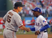 FILE - San Francisco Giants manager Bruce Bochy, left, shakes hands with Texas Rangers manager Ron Washington before Game 3 of baseball's World Series Saturday, Oct. 30, 2010, in Arlington, Texas. There are still fond memories for Washington in Texas, where he returns an opposing manager for the first time when the Los Angeles Angels open a three-game series Friday night, May 17, 2024. (AP Photo/Brian Snyder, Pool, File)