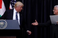 <p>Palestinian President Mahmoud Abbas extends his hand to President Donald Trump during their remarks after their meeting at the Presidential Palace in the West Bank city of Bethlehem May 23, 2017. (Photo: Jonathan Ernst/Reuters) </p>