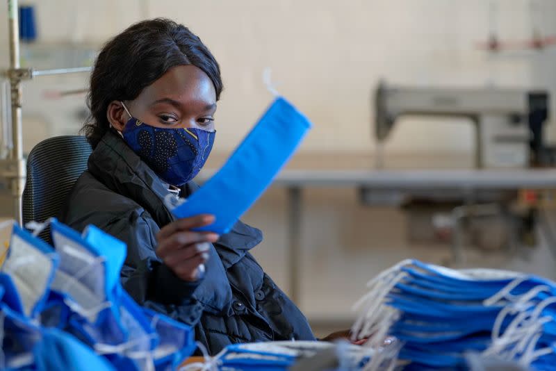 FILE PHOTO: FILE PHOTO: A worker makes masks to help curb the spread of the coronavirus disease (COVID-19) in Melbourne