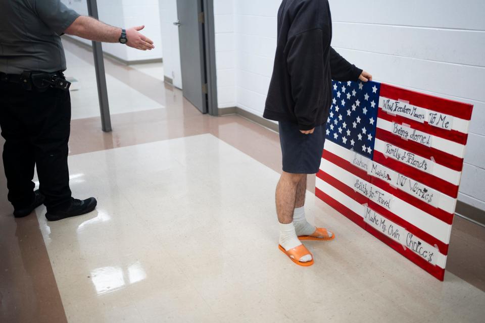 Jun 29, 2023; Lancaster, Ohio, USA; A teenage boy finishes up a "what freedom means to me" group project for the Fourth of July, at Multi-County Juvenile Detention Center.