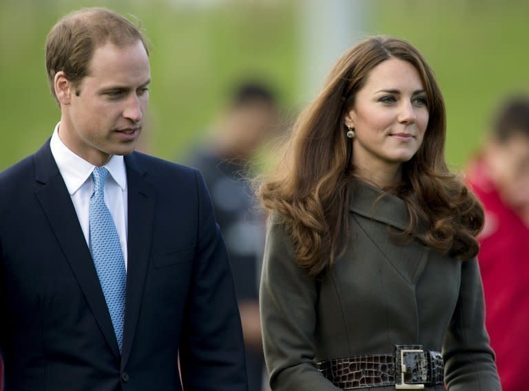 In this file picture taken on October 9, 2012 Prince William and his wife Catherine are seen at the opening of the Football Association's National Fooball Centre, St Georges Park in Burton Upon Trent, England