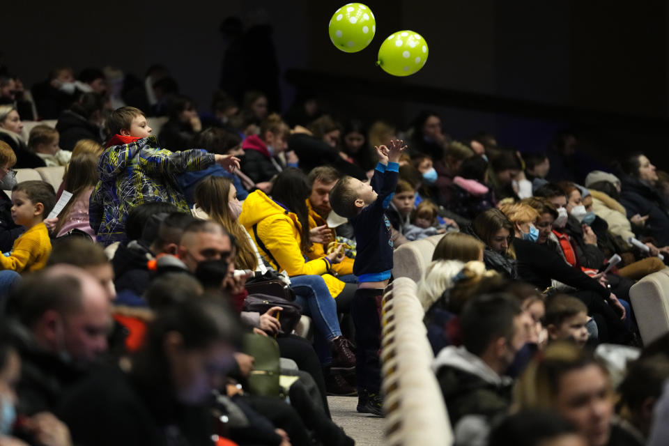 Refugees that fled the war in Ukraine wait to get registered at the congress center in Prague, Czech Republic, on Tuesday, March 15, 2022. It's estimated that more than 200,00 refugees that fled Ukraine arrived in the Czech Republic since the start of the war. (AP Photo/Petr David Josek)