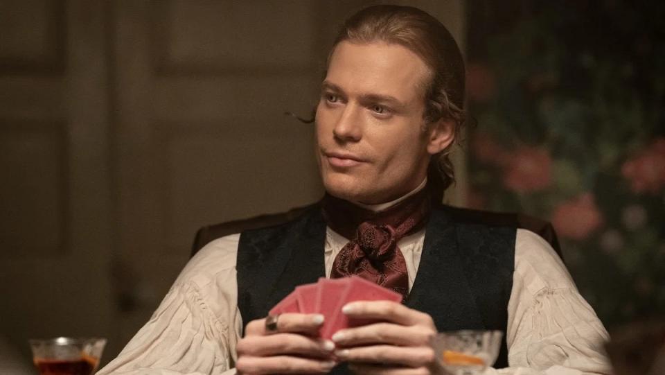 Lestat (Sam Reid) plays cards