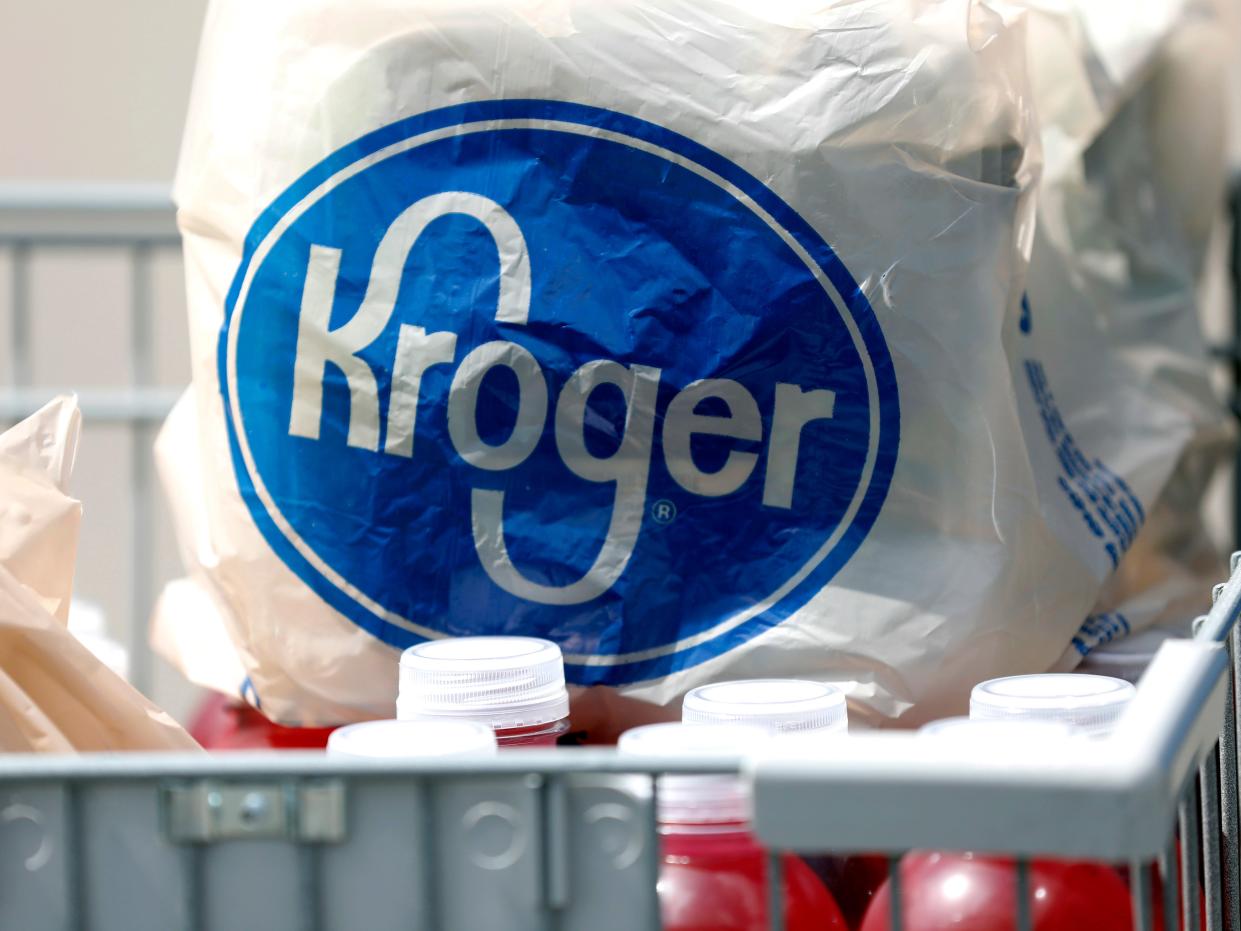 A Kroger bag in a cart