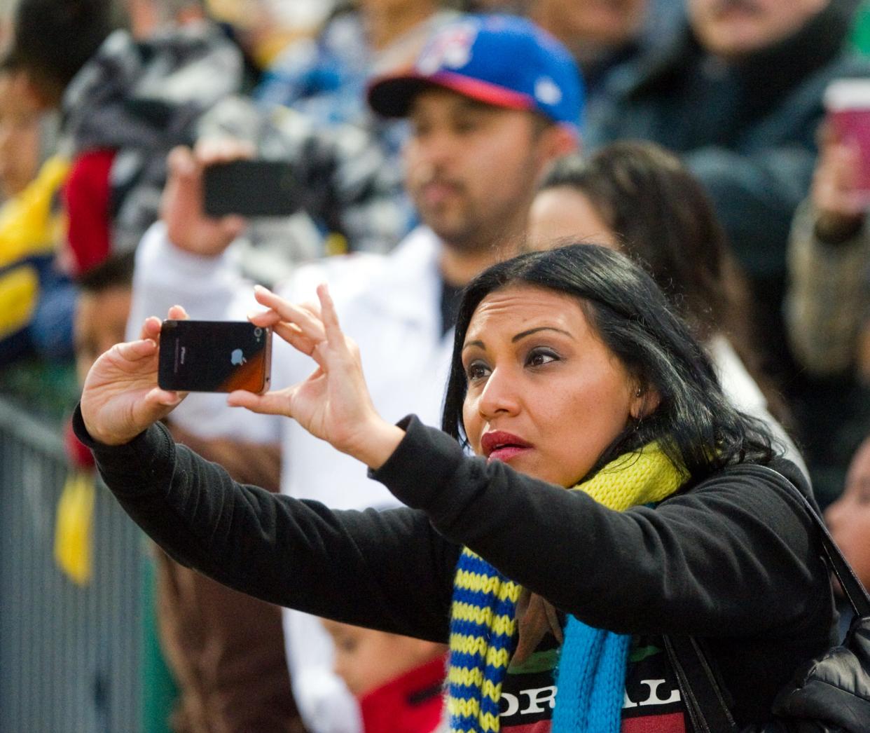 Soccer fans break out their cameras to get a shot of soccer star Cuauhtemoc Blanco during an exhibition game between the Club Dorados De Sinaloa of Mexico and the San Antonio Scorpions FC March 14, 2012, at Stockton Ballpark in downtown Stockton.