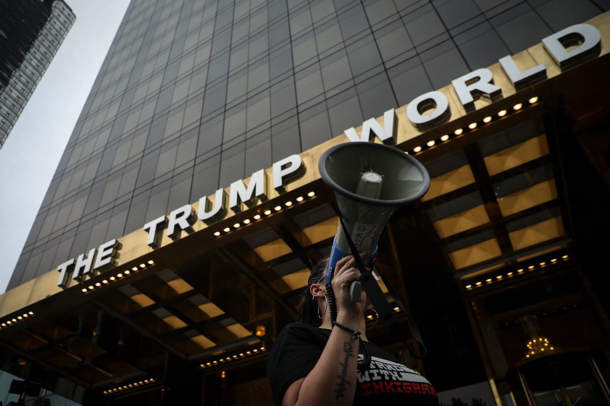 Activists rally outside of Trump World Tower in New York City. 