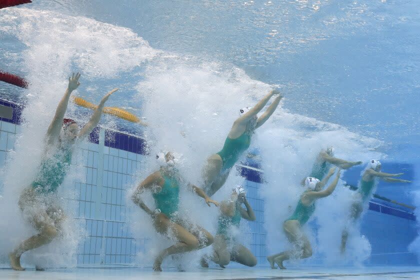 BUDAPEST, HUNGARY - JUNE 30: Abby Andrews #6 and Charlize Andrews #7 of Team Australia jump into the pool.