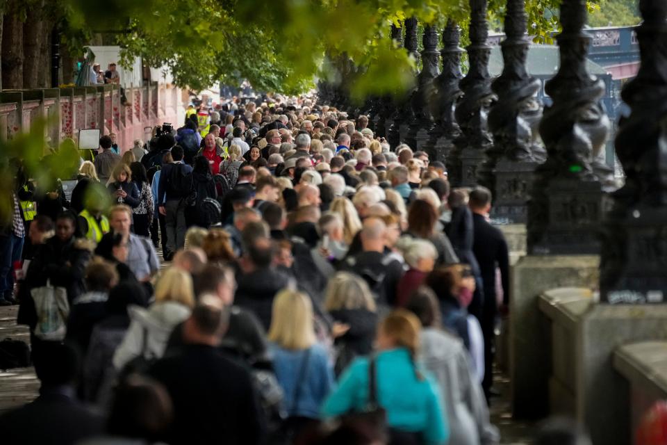 Members of the public wait in line to pay their respects to Queen Elizabeth II as she lays in state within Westminster Hall on September 15, 2022 in London, England.