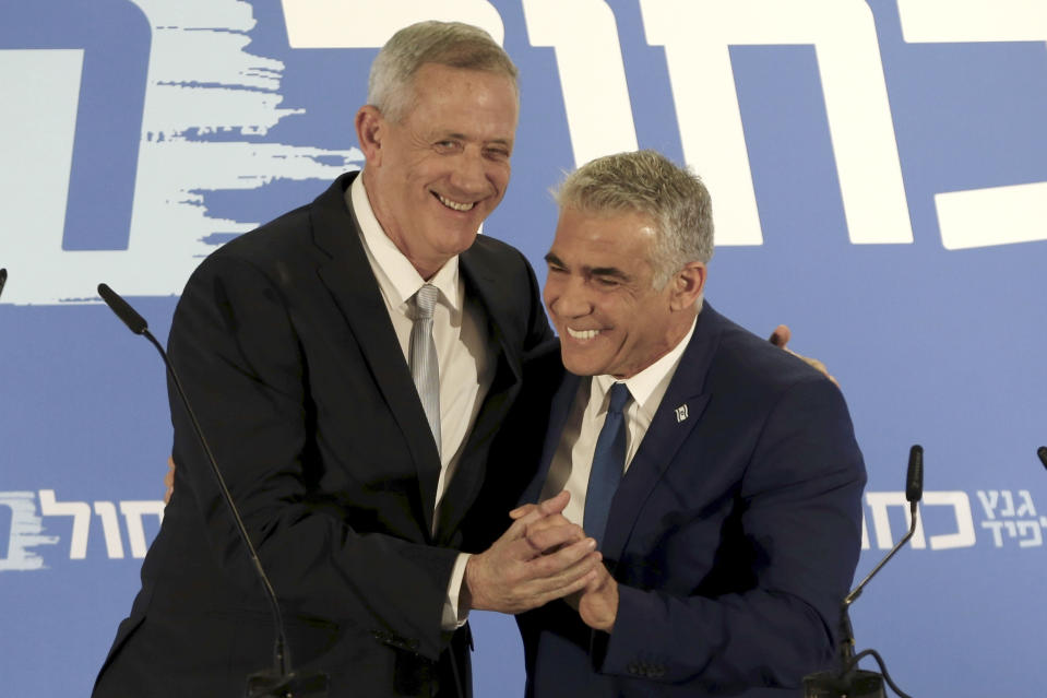 Retired Israeli military chief Benny Gantz, left, with Yair Lapid, head of the Yesh Atid party, as they launch<span> their new Blue and White alliance </span>for the upcoming Israeli elections, in Tel Aviv on Feb. 21. (Photo: Ariel Schalit/AP)