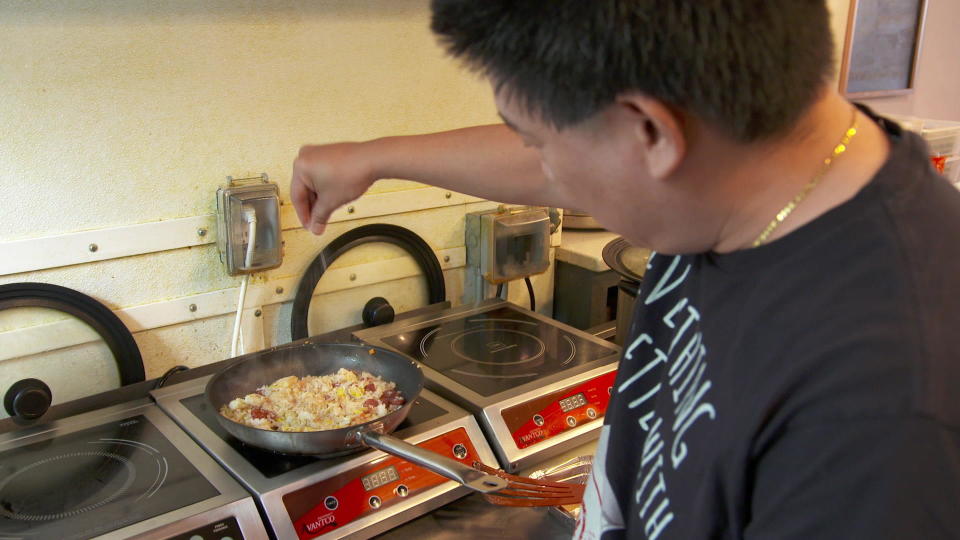 Chris Cheung, who runs the East Wind Snack Shop chain in Brooklyn, New York, has no problem adding MSG to food.  / Credit: CBS News