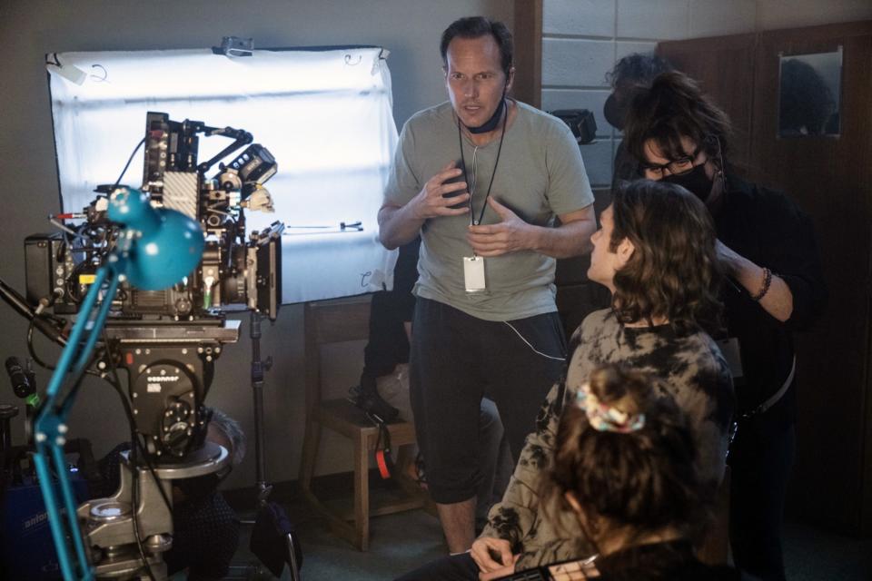 Patrick Wilson, center, and Ty Simpkins, right, on set of ‘Red Door’. Courtesy Sony/Everett Collection