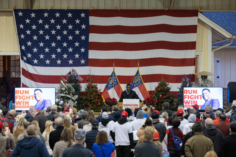 <div class="inline-image__caption"><p>Herschel Walker speaks to a crowd gathered for a rally with prominent Republicans on Nov. 21, 2022, in Milton, Georgia.</p></div> <div class="inline-image__credit">Jessica McGowan/Getty</div>