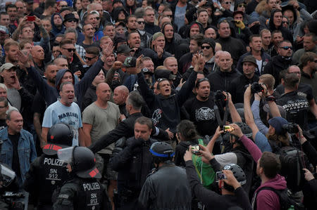 FILE PHOTO: Right-wing supporters protest in Chemnitz, Germany, August 27, after a German man was stabbed. REUTERS/Matthias Rietschel/File Photo