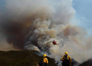 <p>Los Padres National Forest firefighters watch as helicopters work on the northeast flank of the Whittier fire near Hot Spring Canyon outside Cachuma Lake, California, U.S. July 11, 2017. (Mike Eliason/Santa Barbara County Fire/Handout via Reuters) </p>