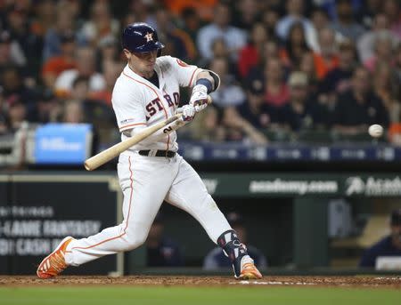 Apr 23, 2019; Houston, TX, USA; Houston Astros third baseman Alex Bregman (2) drives in two runs with an RBI single during the fifth inning against the Minnesota Twins at Minute Maid Park. Mandatory Credit: Troy Taormina-USA TODAY Sports