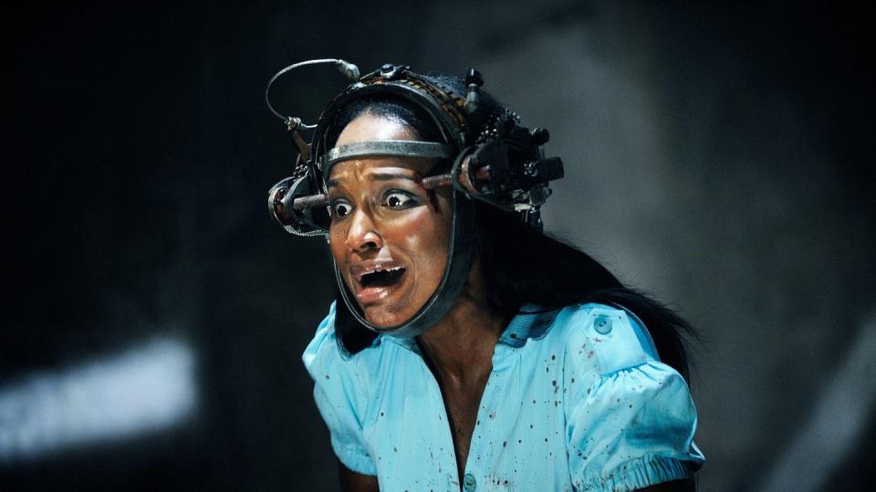 a woman's head is trapped in a device in a scene from saw vi