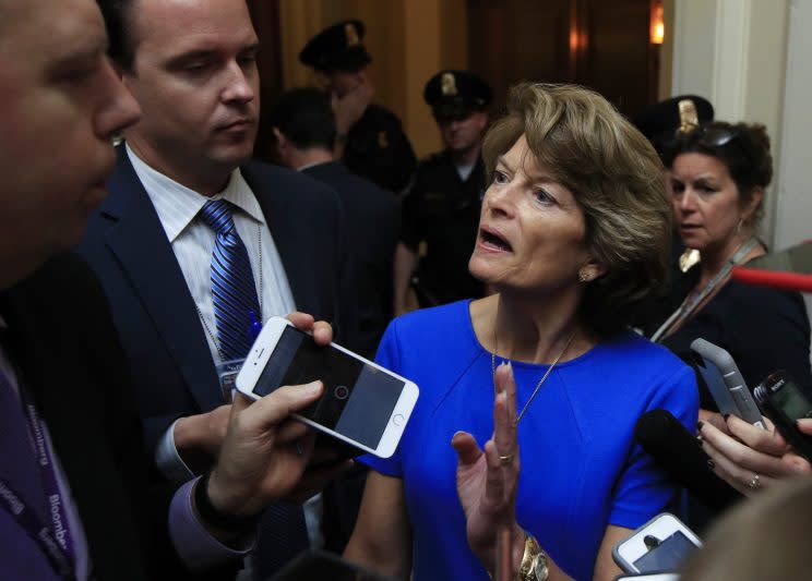 Sen. Lisa Murkowski, R-Alaska, is surrounded by reporters as she walks toward the Senate floor on Capitol Hill in Washington, Tuesday, July 18, 2017. (Photo: Manuel Balce Ceneta/AP)