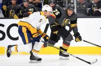 Jan 23, 2019; Las Vegas, NV, USA; Vegas Golden Knights right wing Ryan Reaves (75) skates ahead of Nashville Predators defenseman Dan Hamhuis (5) during the second period at T-Mobile Arena. Mandatory Credit: Stephen R. Sylvanie-USA TODAY Sports