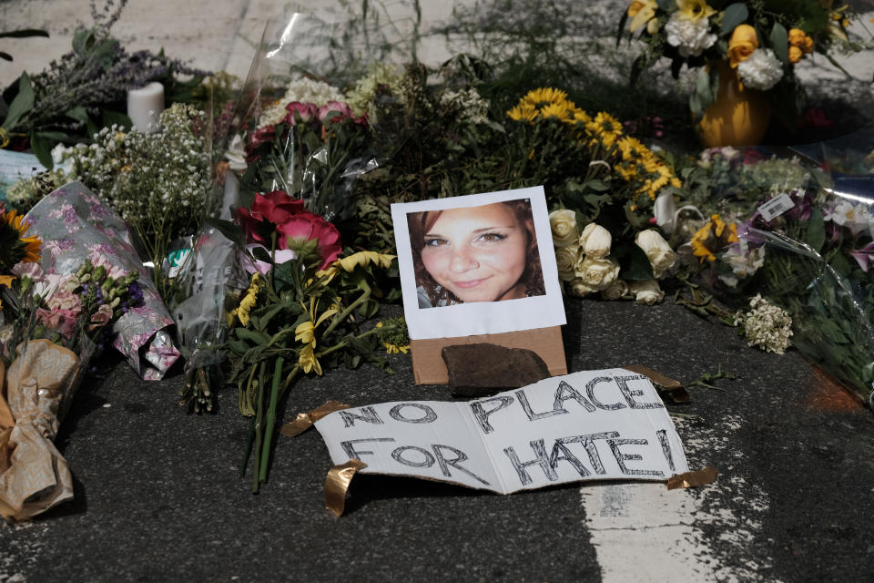 Flowers and a photo of car ramming victim Heather Heyer lie at a makeshift memoriall in Charlottesville, Virginia,  August 13, 2017. (Justin Ide/Reuters)