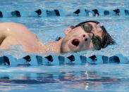 Michael Phelps swims during a training session Wednesday, April 23, 2014, in Mesa, Ariz., as he prepares to compete for the first time since retiring after the 2012 London Games. The 22-time Olympic medalist is entered in three events at the Arena Grand Prix starting Thursday. (AP Photo/Matt York)