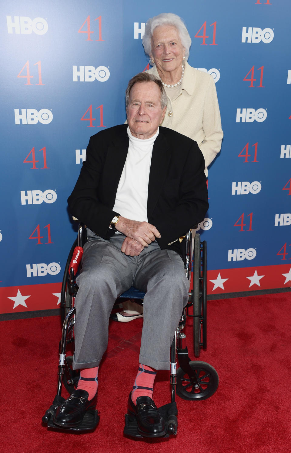 Bush’s salmon socks were a red carpet hit at this HBO Documentary special screening of <em>41</em> in 2012 in Kennebunkport, Maine. (Photo: Getty Images)