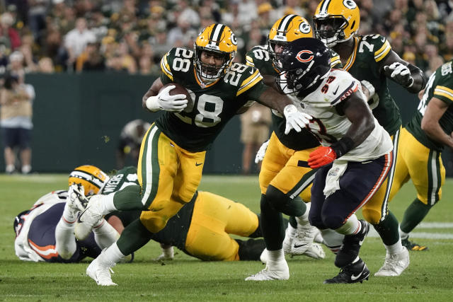 Miami. FL USA; Green Bay Packers running back AJ Dillon (28) is tripped up  while running with the ball short of the end zone during an NFL game again  Stock Photo - Alamy