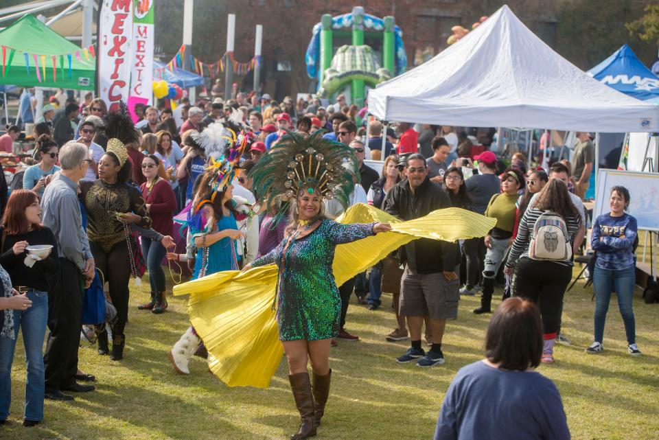 Visitors enjoy the 2019 Pensacola Latino Festival at Pensacola Historic Trust. The festival returns Saturday.