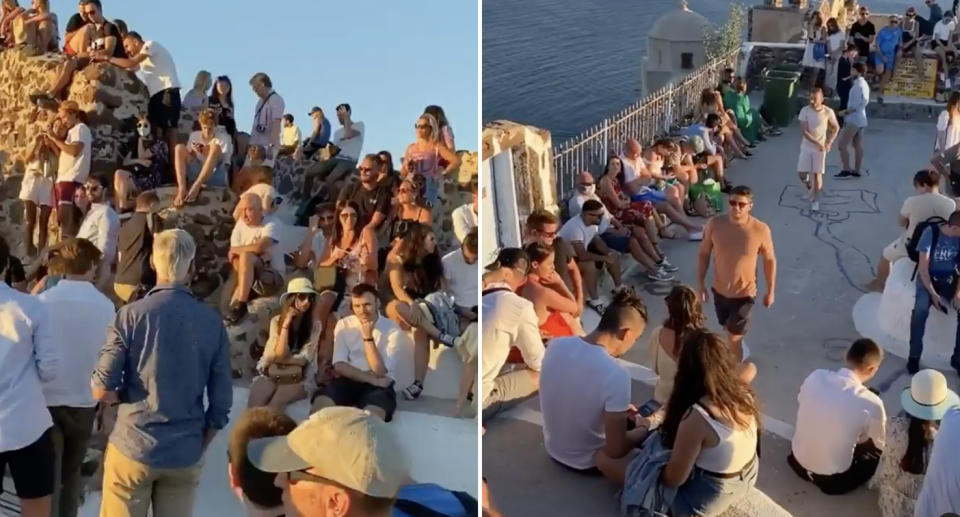 Crowds of people watch a sunset at Santorini during the coronavirus pandemic.