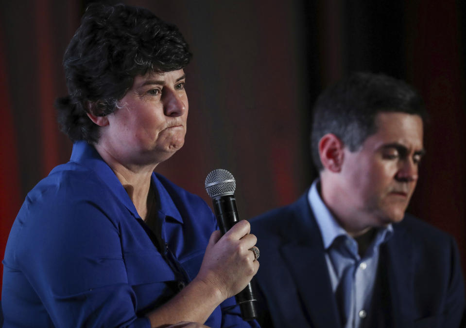 FILE - In this Monday, June 10, 2019 file photo, Susan Codone, left, shares her story of being sexually abused during a panel discussion about sexual abuse and the Southern Baptist Convention, as Russell Moore, right, president of the Ethics and Religious Liberty Commission of the SBC, listens on the eve of the SBC's annual meeting in Birmingham, Ala. Codone, a professor at Mercer University in Macon, Georgia, who says she was abused as a teenager by the youth minister and pastor at her SBC church in Alabama, is scheduled to speak at an SBC conference in early October. (Jon Shapley/Houston Chronicle via AP)