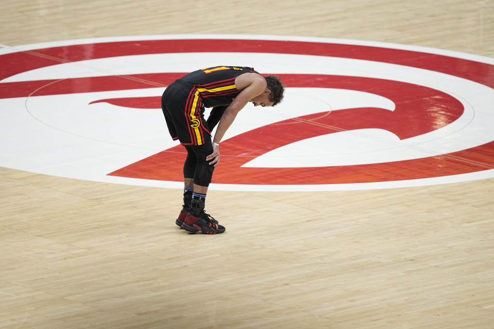 Atlanta Hawks guard Trae Young (11) kneels over near the end of the second half of Game 6 of a first-round NBA basketball playoff series against Boston Celtics, Thursday, April 27, 2023, in Atlanta. (AP Photo/Brynn Anderson)