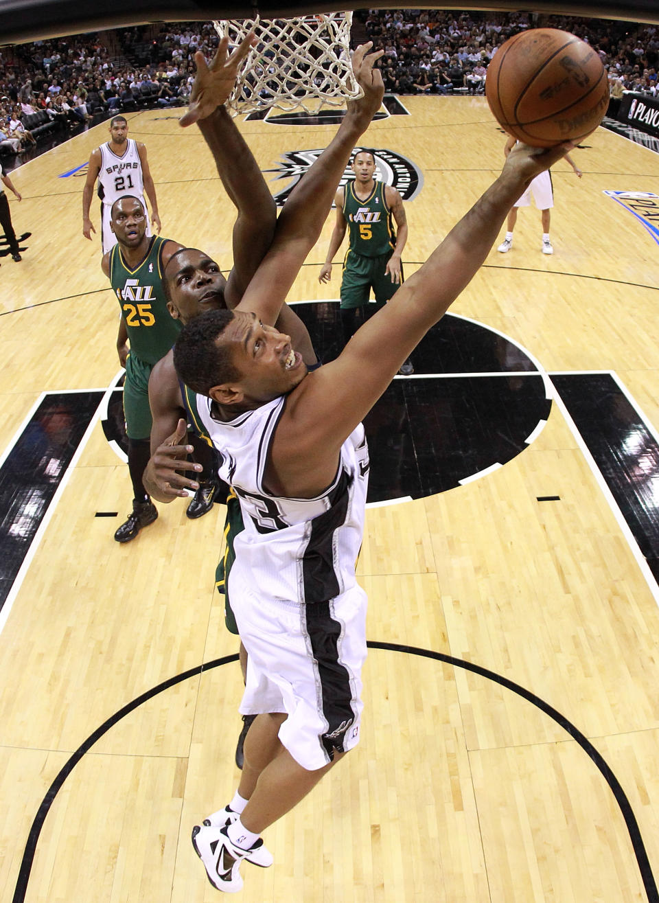 SAN ANTONIO, TX - MAY 02: Boris Diaw #33 of the San Antonio Spurs takes a shot against Paul Millsap #24 of the Utah Jazz in Game Two of the Western Conference Quarterfinals of the 2012 NBA Playoffs at AT&T Center on May 2, 2012 in San Antonio, Texas. NOTE TO USER: User expressly acknowledges and agrees that, by downloading and or using this photograph, User is consenting to the terms and conditions of the Getty Images License Agreement. (Photo by Ronald Martinez/Getty Images)