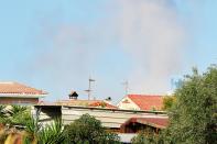 Smoke rises from a controlled explosion carried out by police in Alcanar