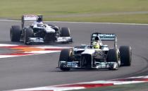 Mercedes Formula One driver Nico Rosberg of Germany (front) and Williams Formula One driver Valtteri Bottas of Finland drive during the qualifying session of the Indian F1 Grand Prix at the Buddh International Circuit in Greater Noida, on the outskirts of New Delhi, October 26, 2013. REUTERS/Ahmad Masood (INDIA - Tags: SPORT MOTORSPORT F1)