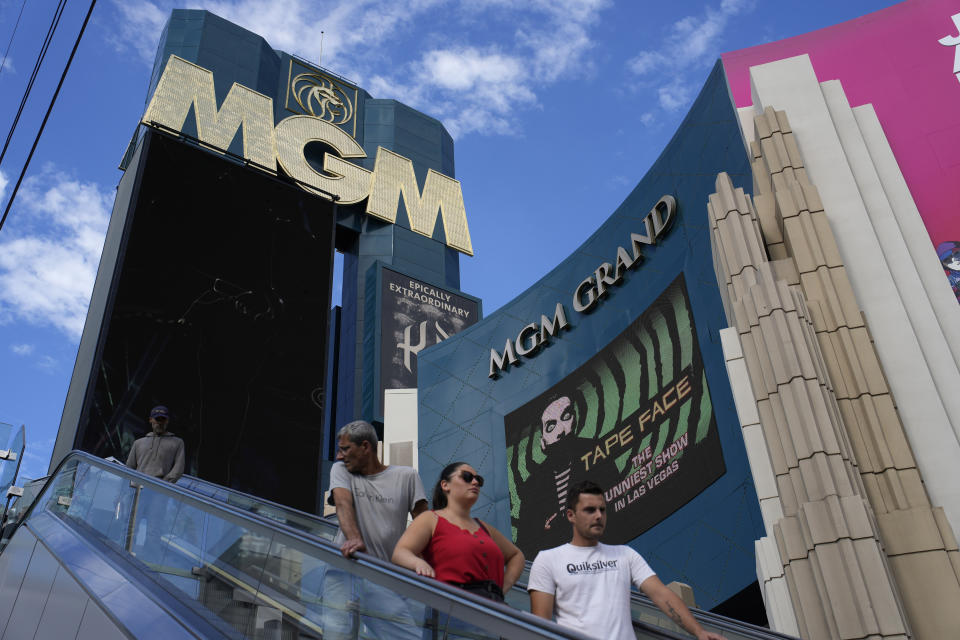 People ride an escalator by the MGM Grand hotel-casino Wednesday, Sept. 13, 2023, in Las Vegas. Casino operator MGM Resorts International said Tuesday that resorts are open and an investigation is continuing after what it called a “cybersecurity issue” led to the shutdown of computer systems at company properties across the U.S. (AP Photo/John Locher)
