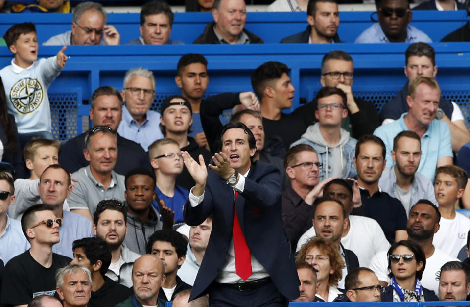 Arsenal's manager Unai Emery applauds during the English Premier League soccer match between Chelsea and Arsenal at Stamford bridge stadium in London, Saturday, Aug. 18, 2018. (AP Photo/Alastair Grant)