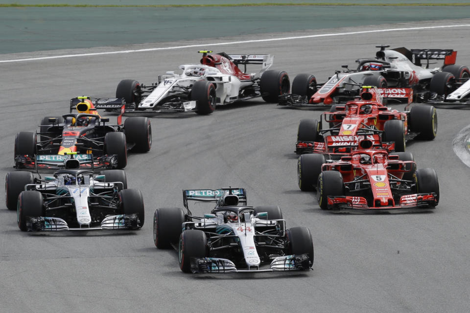 Mercedes driver Lewis Hamilton, of Britain, leads the race after the start of the Brazilian Formula One Grand Prix at the Interlagos race track in Sao Paulo, Brazil, Sunday, Nov. 11, 2018. (AP Photo/Nelson Antoine)