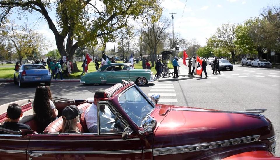 Organizers and marchers walked from Chavez Park to 10th Street plaza to commemorate the birthday of labor leader Cesar Chavez in Modesto, Calif., Friday, March 31, 2023.