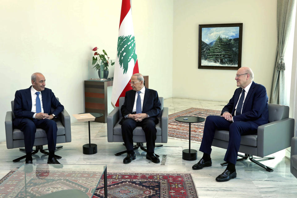 In this photo released by Lebanon's official government photographer Dalati Nohra, Lebanese President Michel Aoun, center, meets with Lebanese Prime Minister-designate Najib Mikati, right, and Lebanese Parliament Speaker Nabih Berri, at the Presidential Palace in Baabda, east of Beirut, Lebanon, Thursday, June 23, 2022. President Aoun appointed Mikati, a billionaire businessman and former prime minister as the next premier-designate after his consultations with members of parliamentary blocs to name a new prime minister following last month's parliamentary elections. (Dalati Nohra via AP)