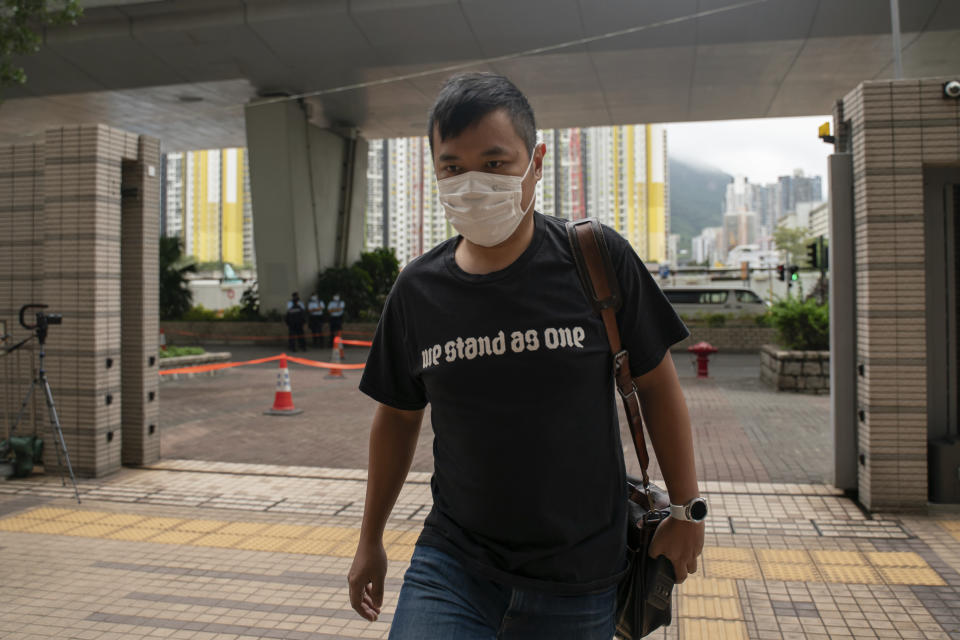 Former secretary for the 612 Humanitarian Relief Fund Sze Ching-wee arrives at the West Kowloon Magistrates's Courts in Hong Kong, Friday Nov. 25, 2022. Hong Kong Cardinal Joseph Zen and five others were in court on Friday over charges of failing to register a now-defunct fund that aimed at helping people arrested in the widespread protests three years ago. (AP Photo/Anthony Kwan)