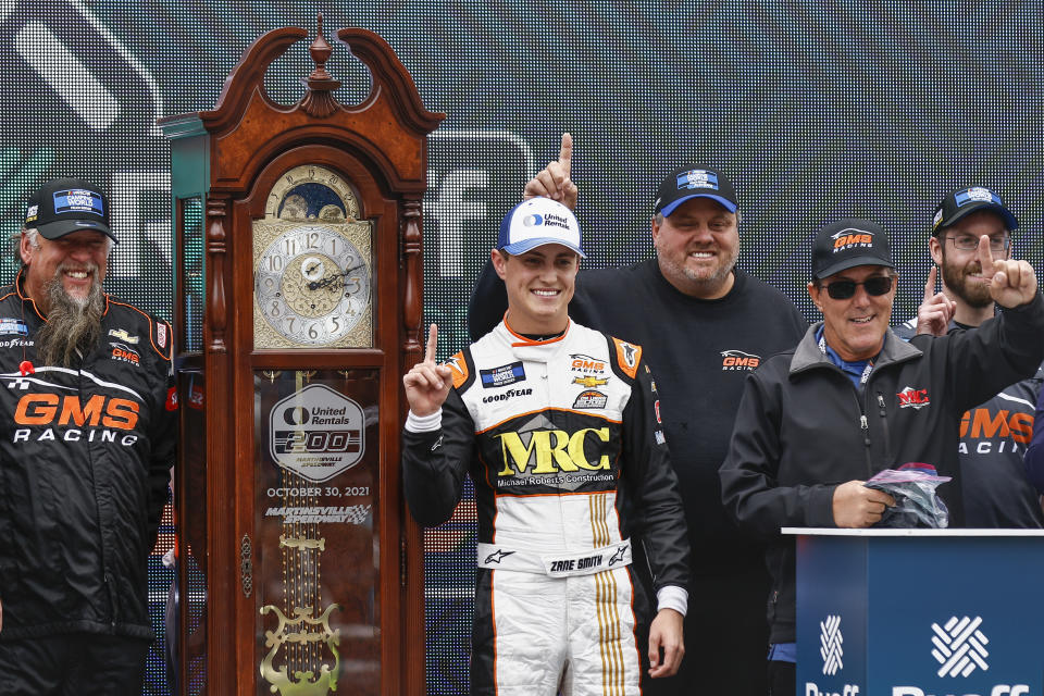 Driver Zane Smith celebrates with teammates after winning a NASCAR Truck Series race on Saturday, Oct. 30, 2021, in Martinsville, Va. (AP Photo/Wade Payne)