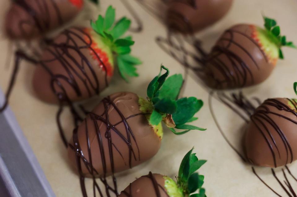 Hand-dipped chocolate-covered strawberries are made throughout the day at Peterbrooke Chocolatier's 27 locations.